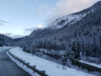 Scenic view of snow covered mountains against sky