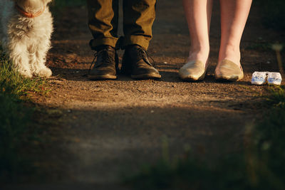 Low section of man standing on street