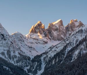 Scenic view of snowcapped mountains against clear sky