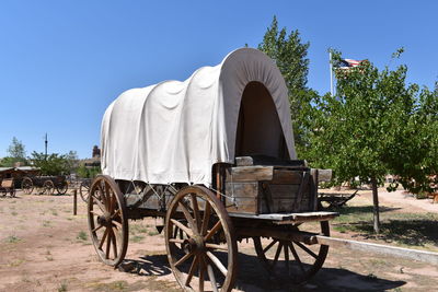 Horse cart against clear sky