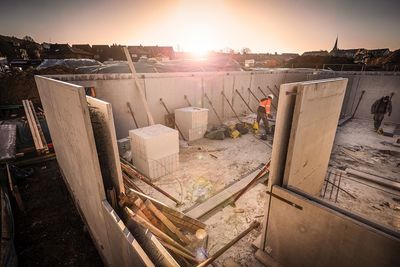 High angle view of old buildings against sky during sunset