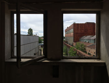 View of cityscape through window