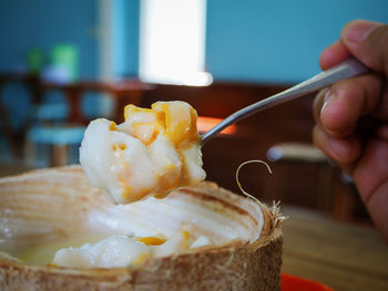 Close-up of hand holding ice cream