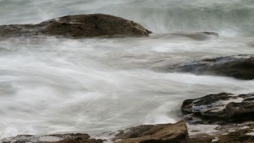 Scenic view of rocks in sea