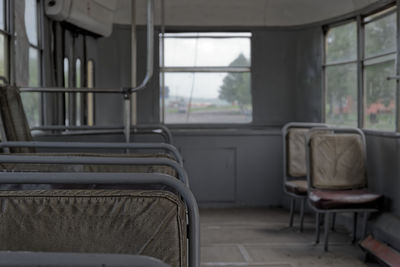 Empty chairs in an old retro bus