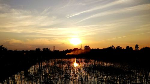 Scenic view of silhouette landscape against sky during sunset