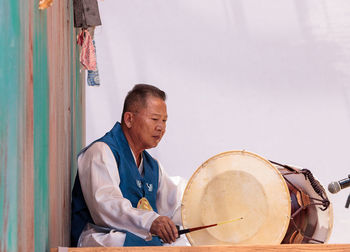 Rear view of man sitting at music concert