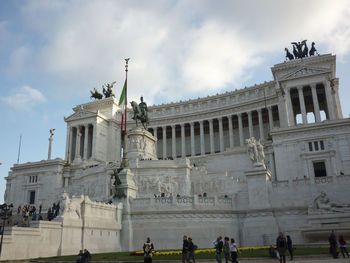 Low angle view of historical building against cloudy sky