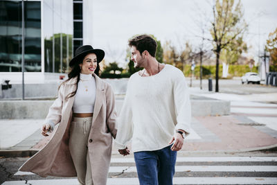 Young couple standing in city