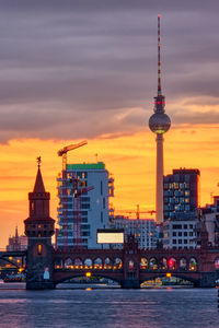 Beautiful sunset at the river spree in berlin with the oberbaum bridge and the television tower
