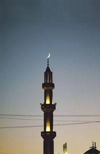 Low angle view of lighthouse against clear sky