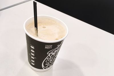 High angle view of coffee cup on table