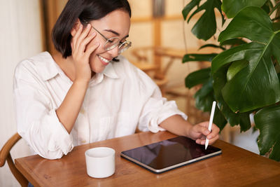 Young woman using mobile phone