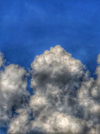 Low angle view of cloudscape against blue sky