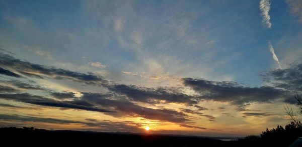 Low angle view of dramatic sky during sunset