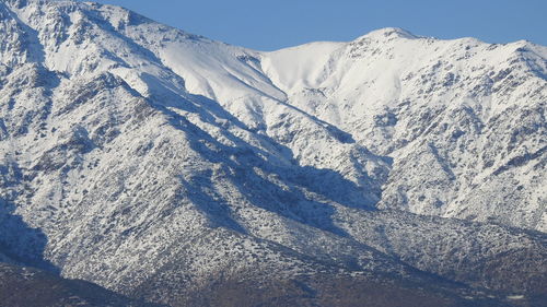 Snow covered mountains against sky