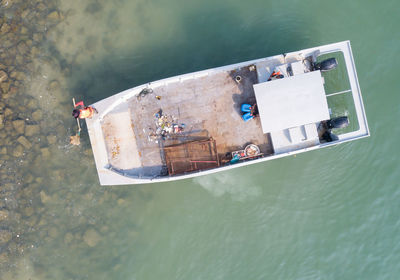 High angle view of boat floating on water