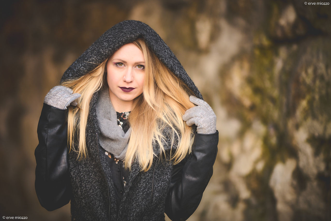 women, one person, adult, clothing, portrait, young adult, long hair, hat, fashion, hairstyle, looking at camera, front view, blond hair, warm clothing, winter, female, photo shoot, emotion, smiling, lifestyles, nature, jacket, waist up, happiness, autumn, fashion accessory, copy space, black, portrait photography, arts culture and entertainment, casual clothing, outdoors, person, cold temperature, human face