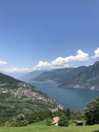 Scenic view of mountains against blue sky