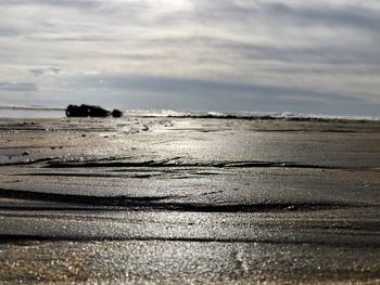 Scenic view of beach against sky