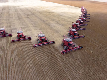 High angle view of combine harvesters on field