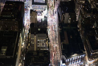 Aerial view of city lit up at night