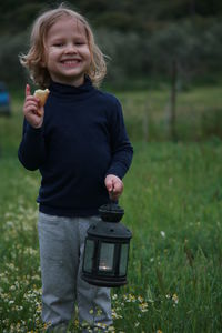Happy girl standing on field