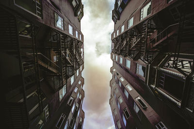 Low angle view of buildings in city against sky