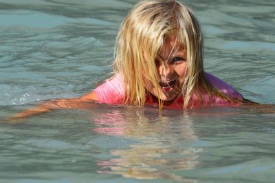 Portrait of girl swimming in pool