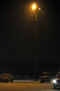 Illuminated street light at night