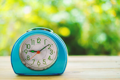 Close-up of clock on table