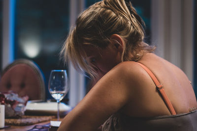 Portrait of woman sitting at home