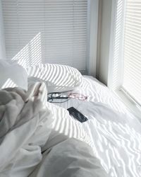 Cat sleeping on bed at home