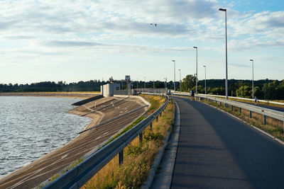 Road by street against sky