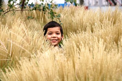 Happy young woman on grassy field