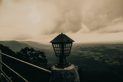 Built structure on mountain against sky