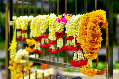 Flower garlands hanging on the railing