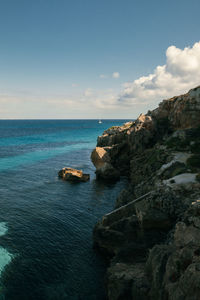 The cliffs, coastline, with the clear sea water, tranquil nature scene with sky.