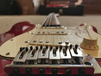 Close-up of electric guitar on table