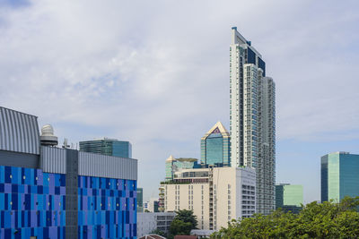 Skyscrapers in city against sky