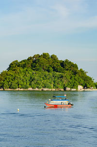 Boat in sea against sky