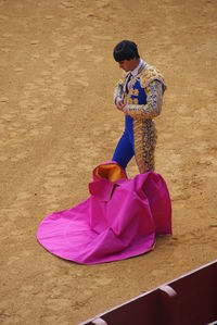 High angle view of woman holding umbrella