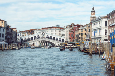 Canal amidst buildings in city