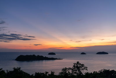 Scenic view of sea against romantic sky at sunset