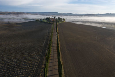 Aerial view at farmhouse poggio covili in tuscany at sunrise.