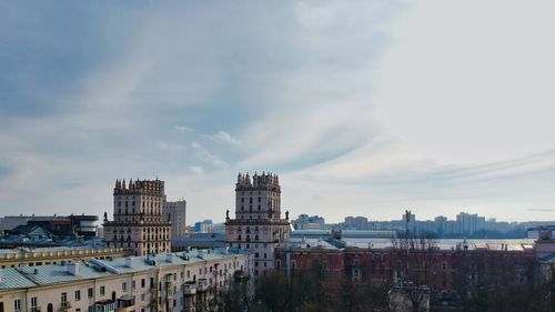 Buildings in city against sky