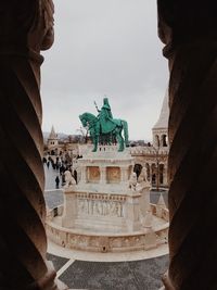 Statue of historic building against sky