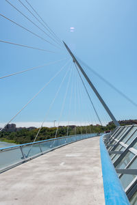 Suspension bridge against clear blue sky