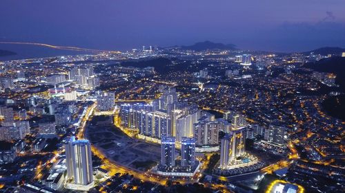 High angle view of illuminated cityscape at night