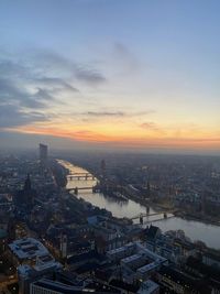 Aerial view of cityscape against sky during sunset